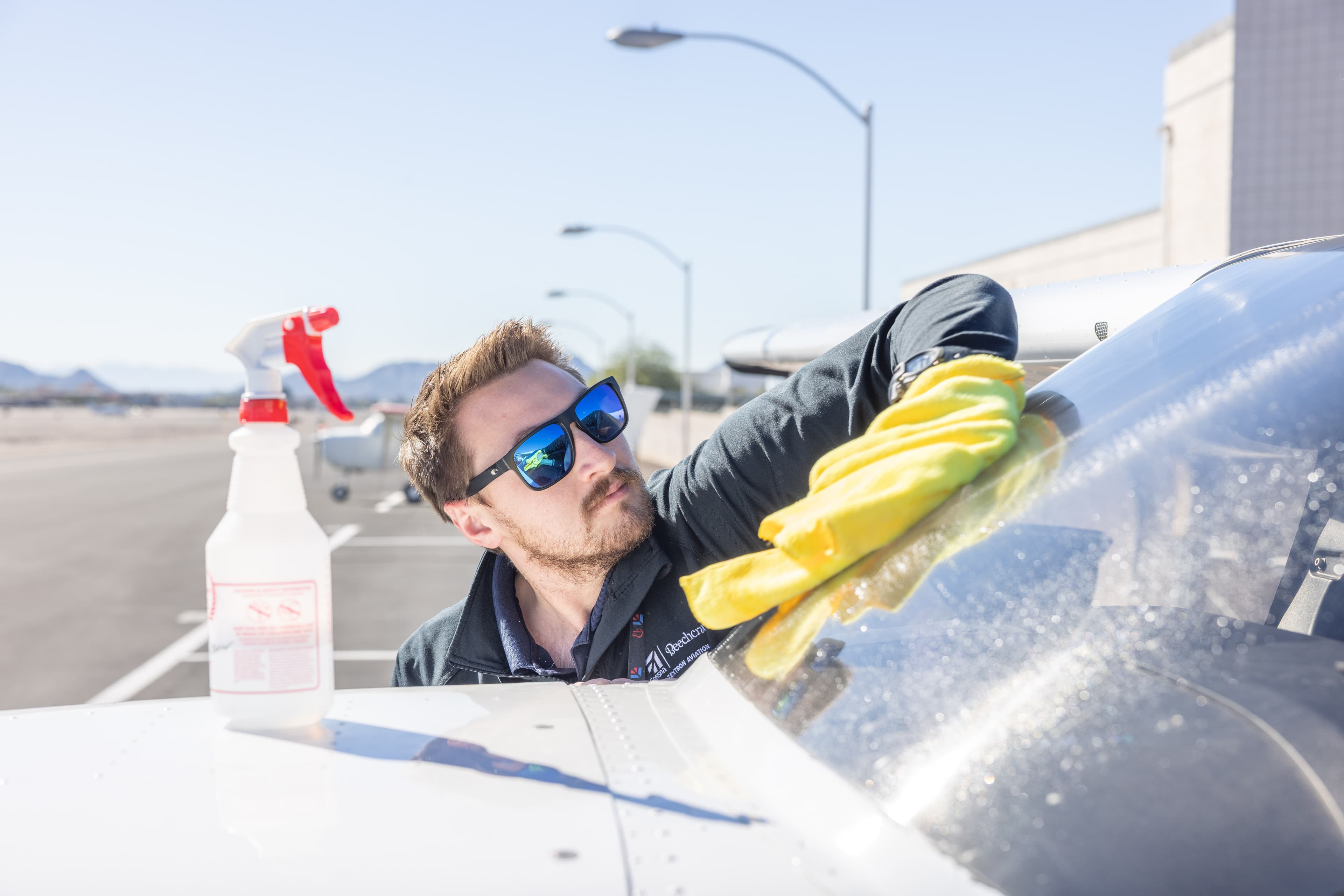 Cleaning a training aircraft windshield