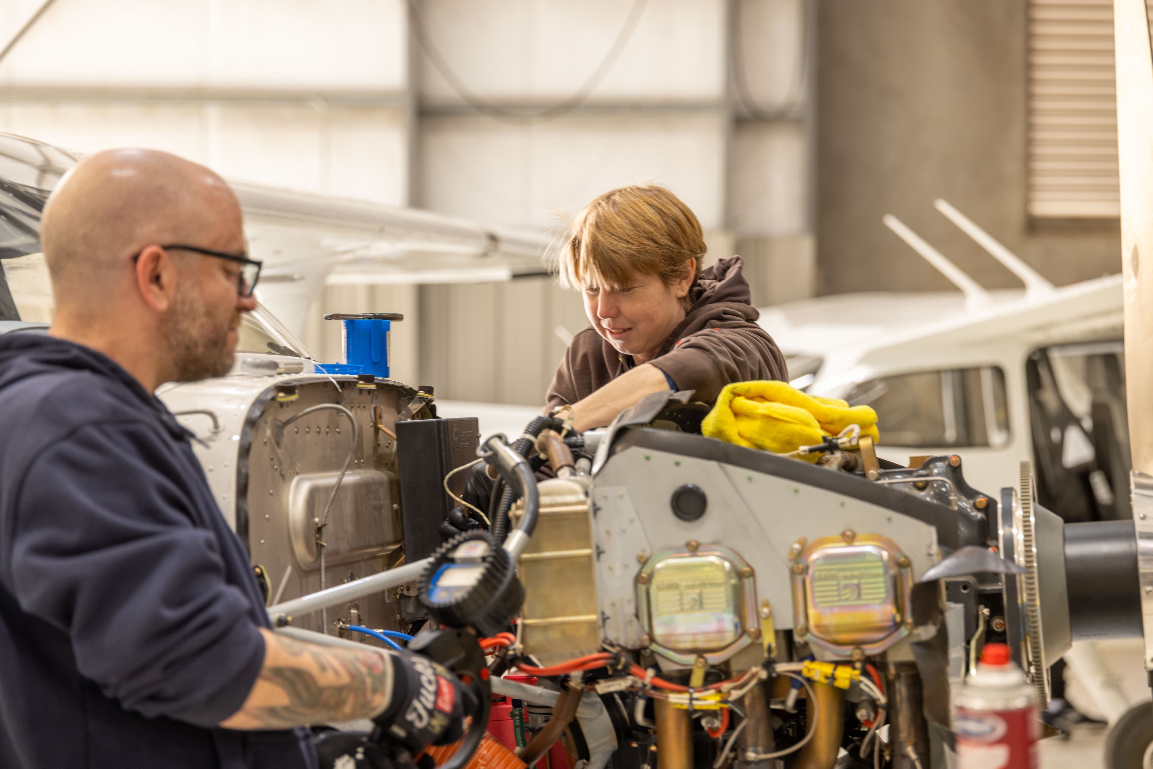 Mechanics working together in the hangar