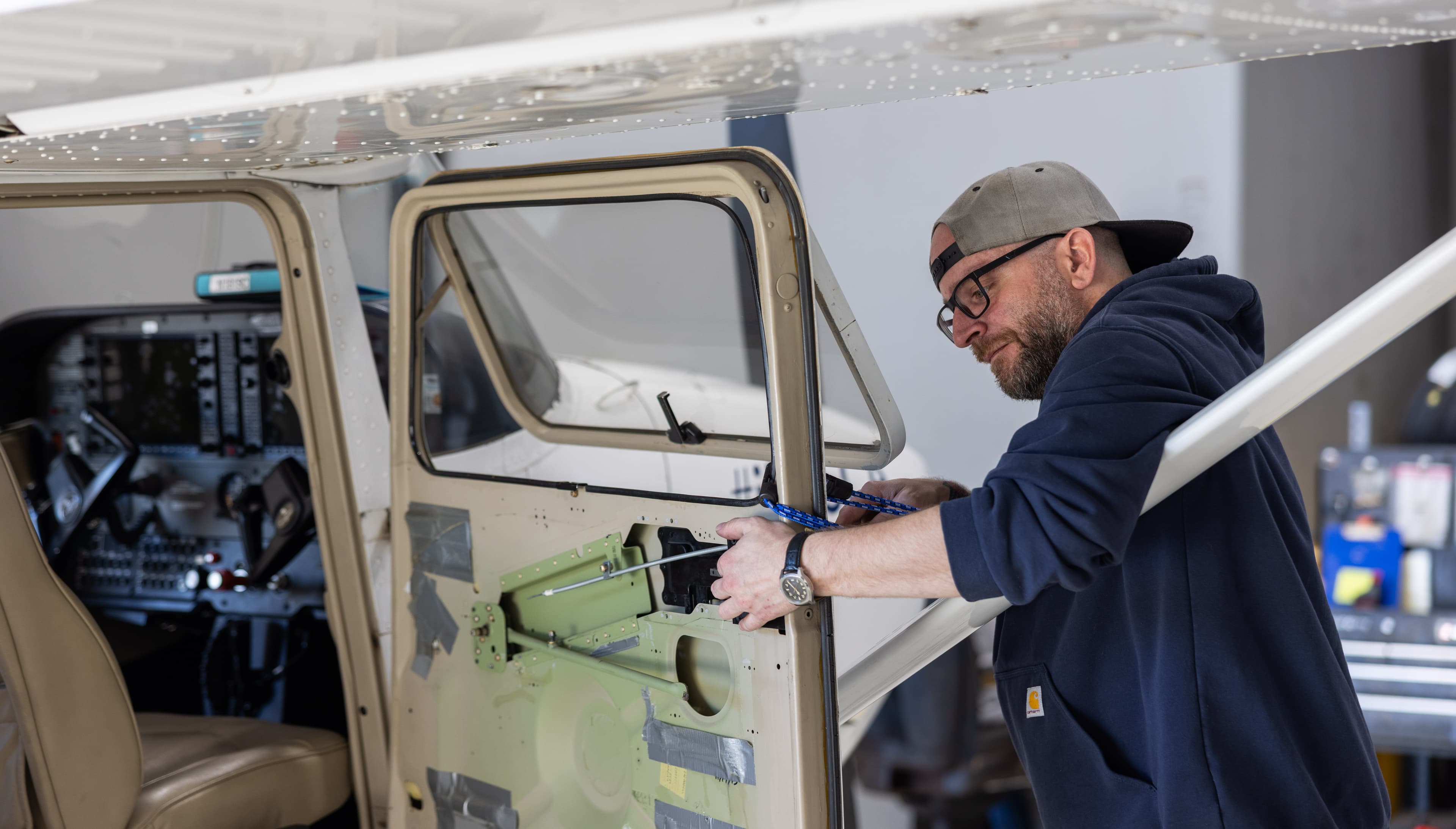Mechanic working on an aircraft door